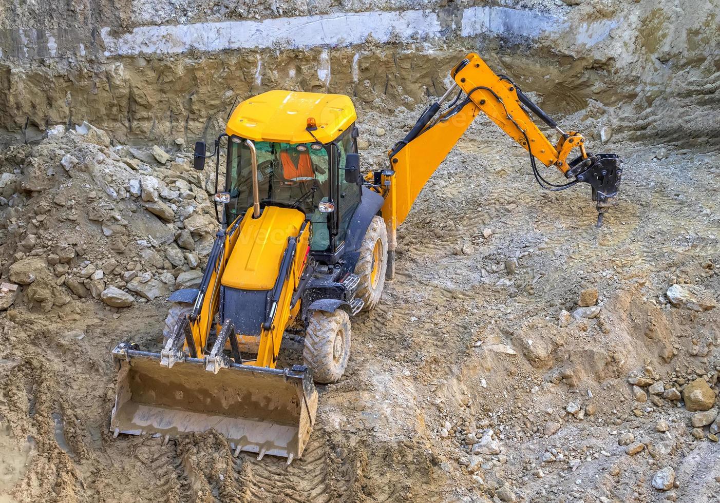 Excavator. Construction equipment working at the construction site photo