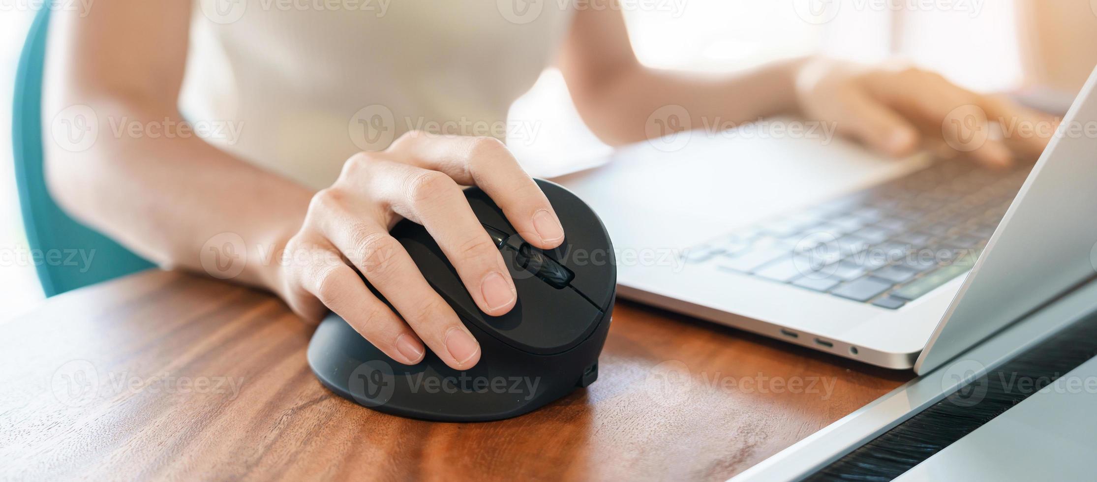 woman hand using computer ergonomic mouse, prevention wrist pain because working long time. De Quervain s tenosynovitis, Intersection Symptom, Carpal Tunnel Syndrome or Office syndrome concept photo