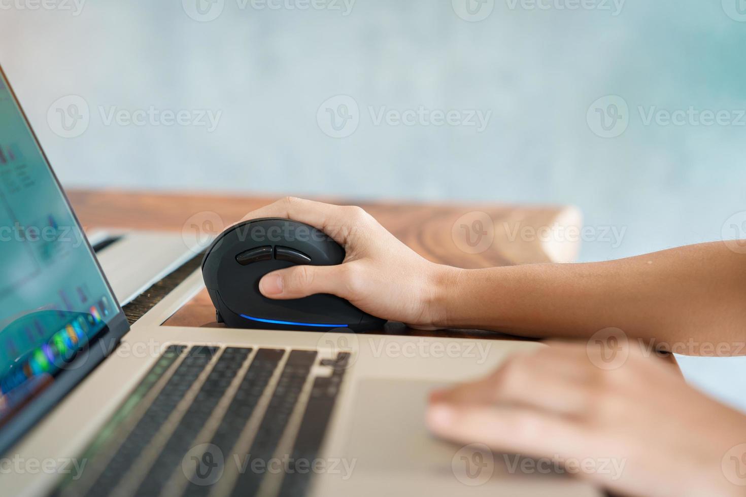 woman hand using computer ergonomic mouse, prevention wrist pain because working long time. De Quervain s tenosynovitis, Intersection Symptom, Carpal Tunnel Syndrome or Office syndrome concept photo
