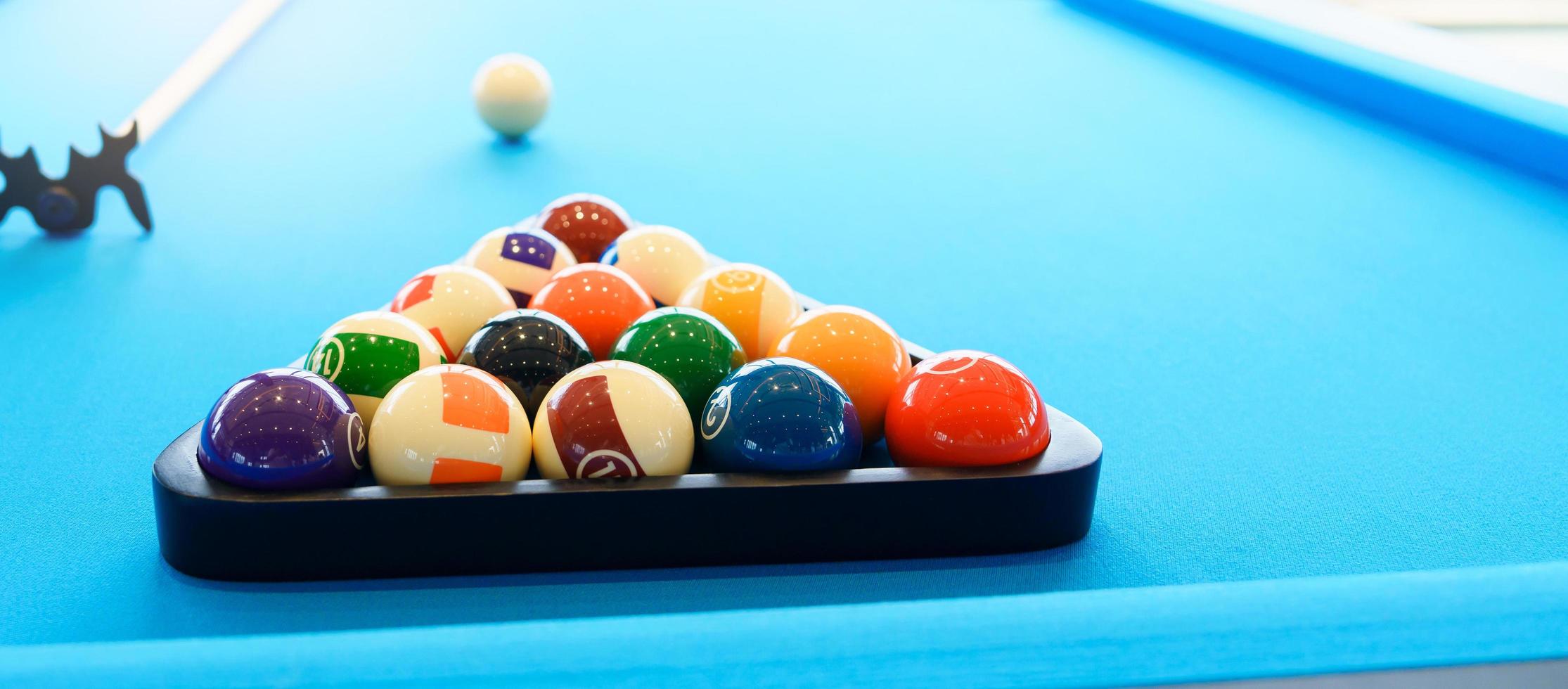 Billiard balls set on the table with a cue, snooker pool photo