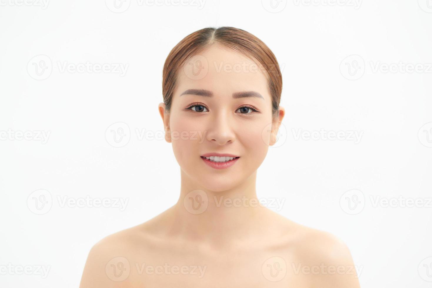 Beauty Asian Woman face Portrait. Beautiful Spa model Girl with Perfect Fresh Clean Skin. Youth and Skin Care Concept. Isolated on a white background photo