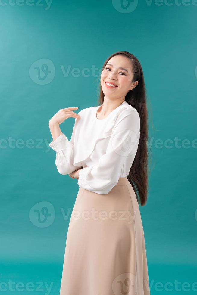 portrait of a modern young woman .isolated on blue photo