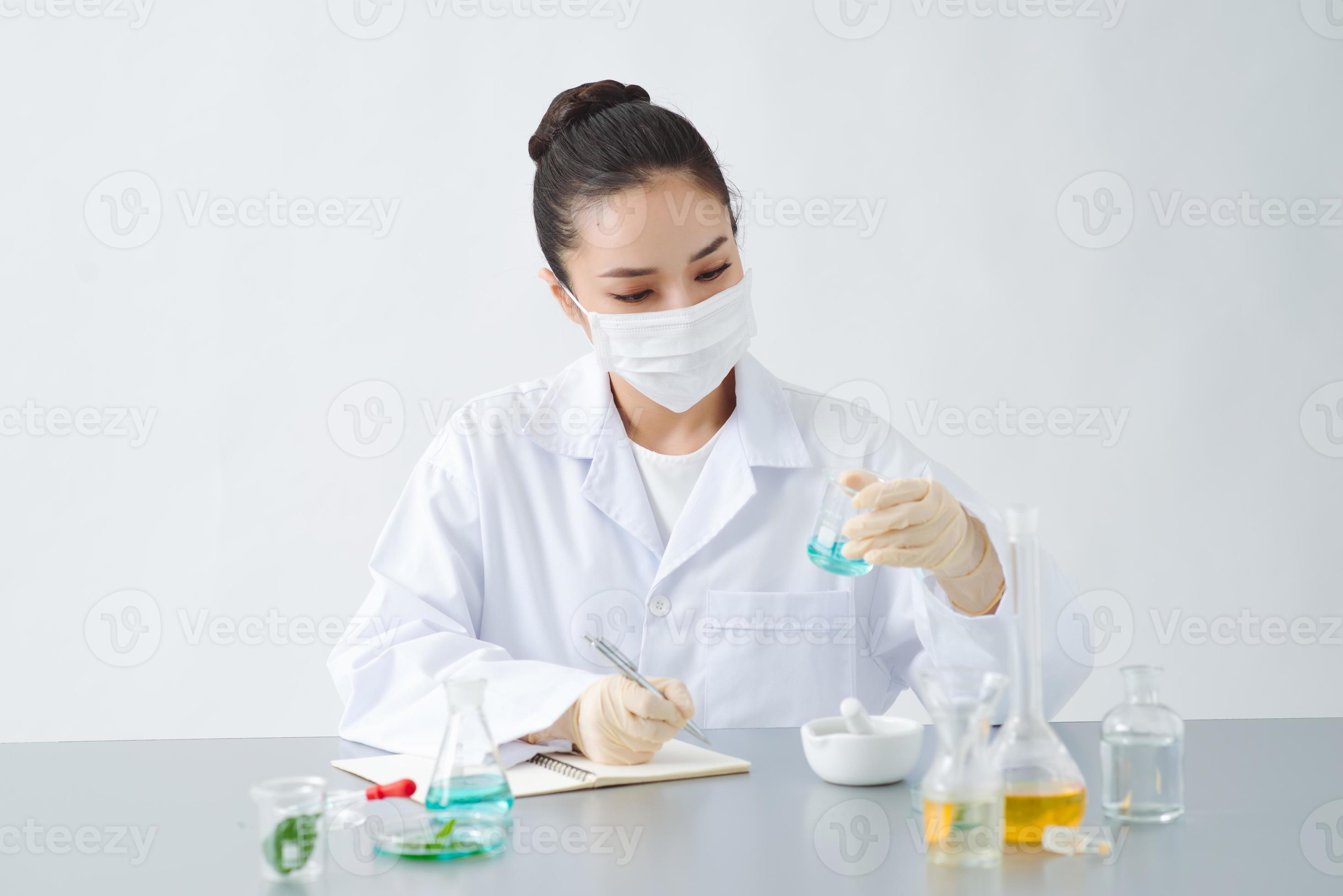 doctor woman scientist making herbal medicine in lab with herb leaves