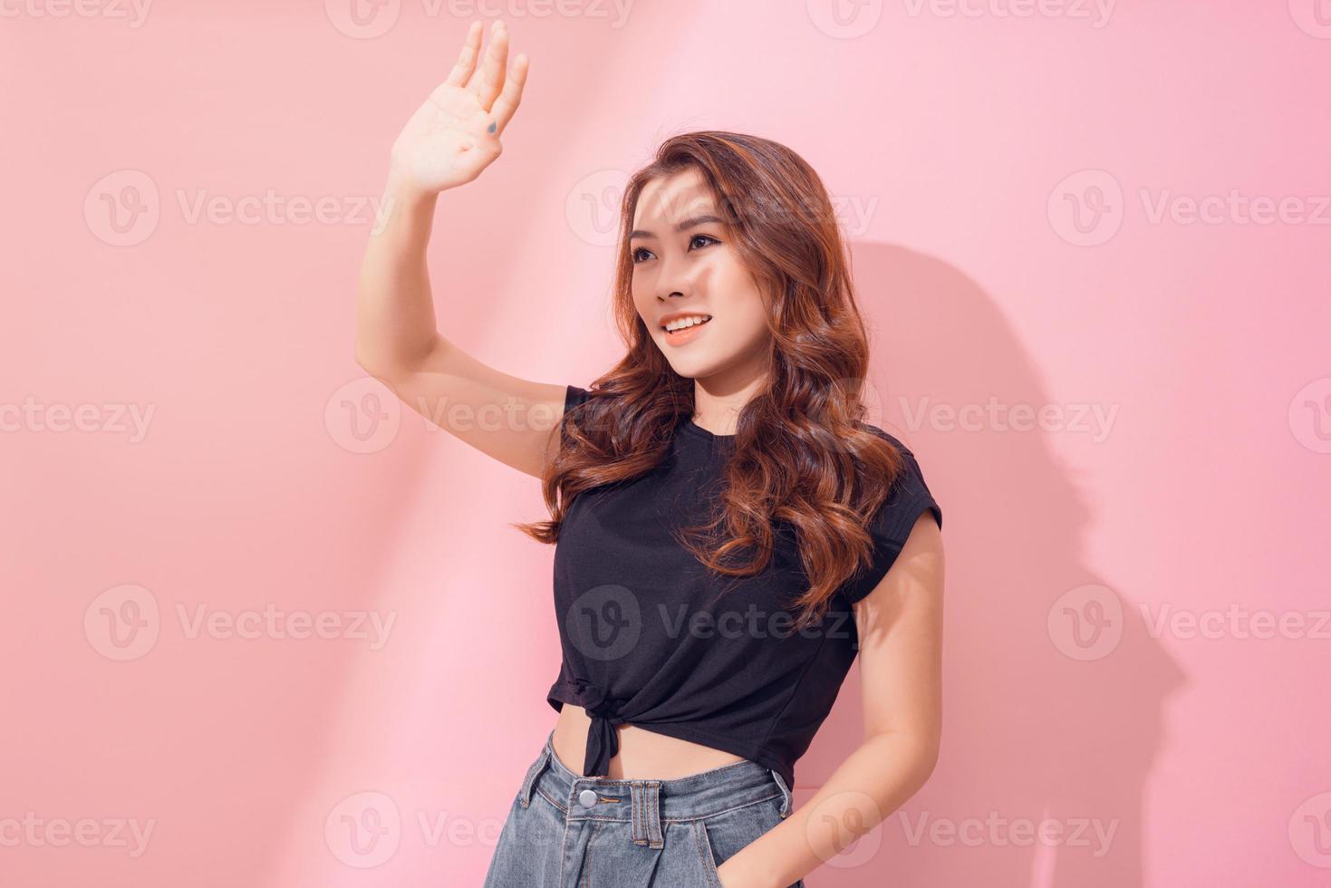 Beautiful Asian young woman hand up cover face protect sun light and UV smile and cheerful photo