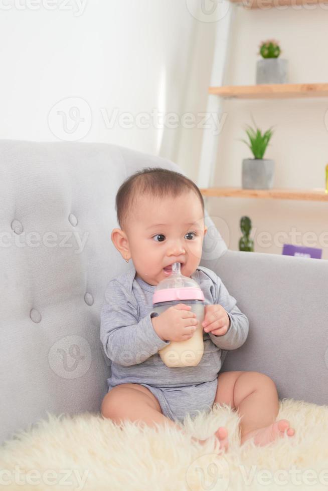 Image of a baby drinking milk photo