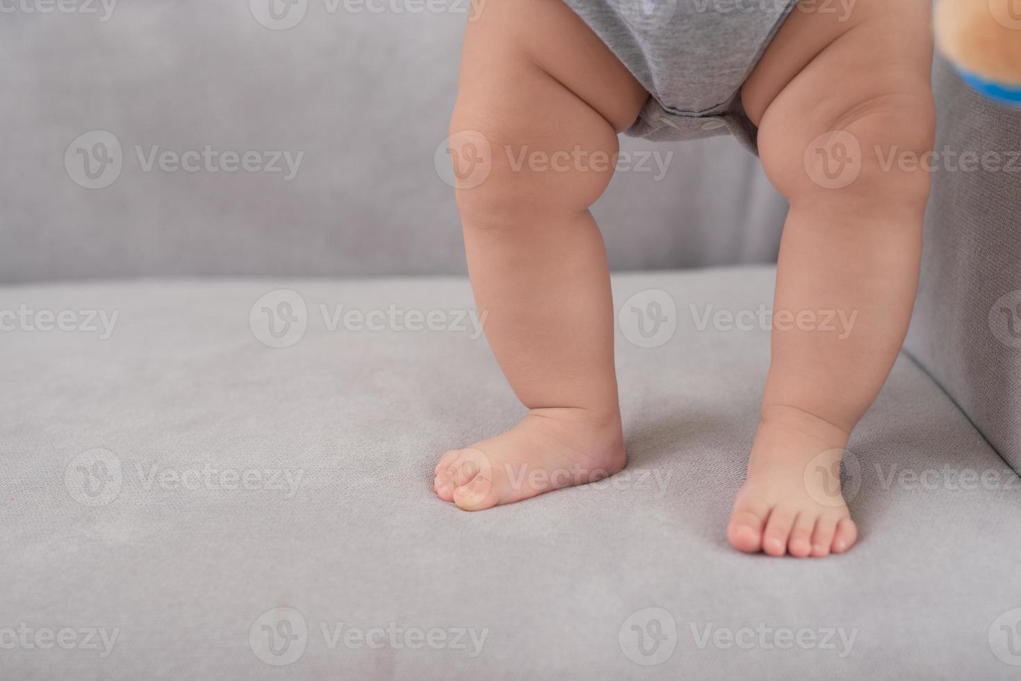 Close up of the charming small legs doing the first steps photo