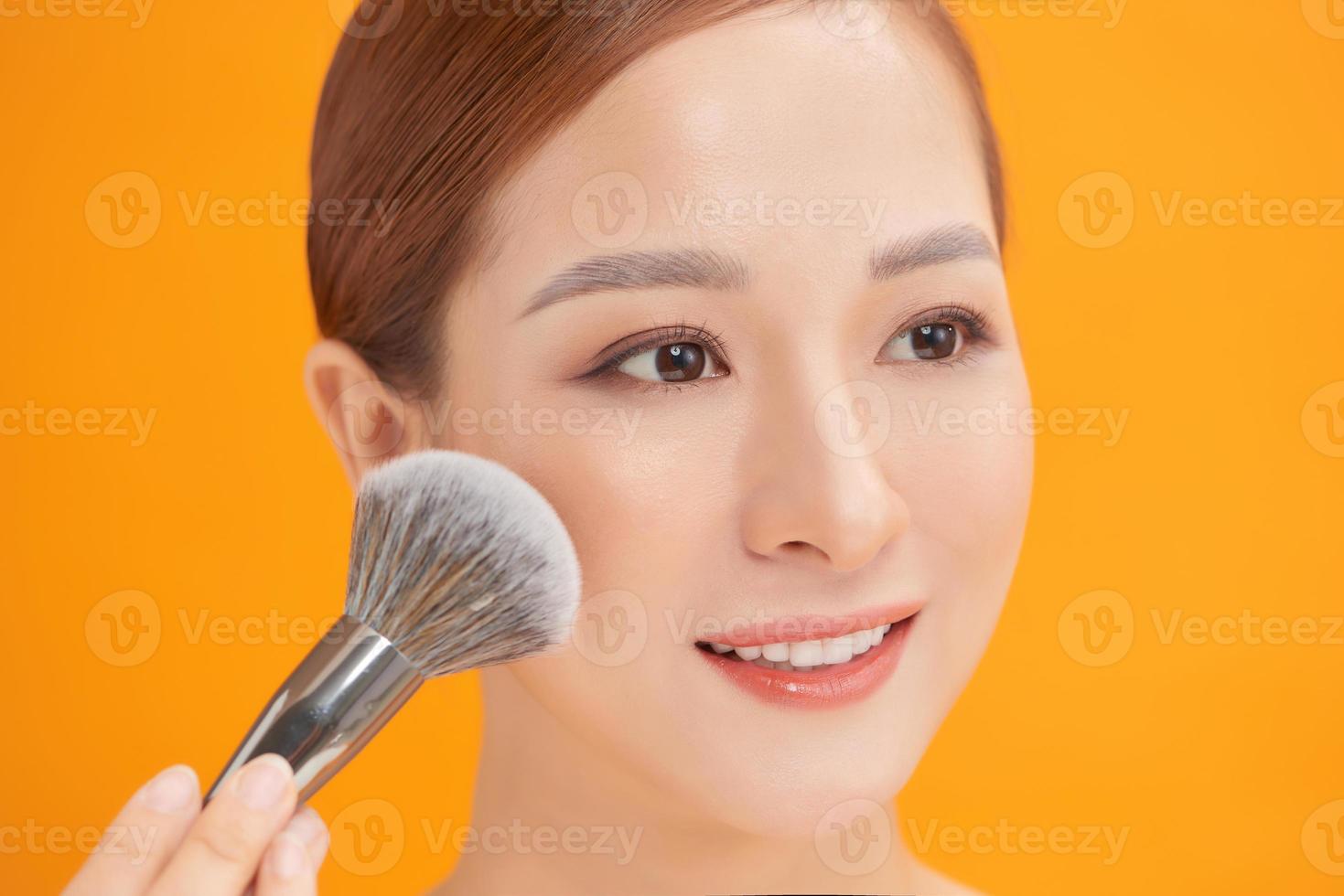 Woman making up makeup, foundation, brush photo