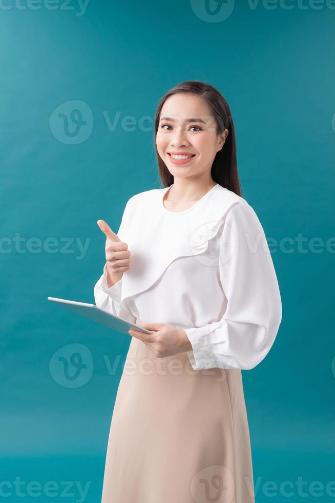 Woman hold with tablet and thumb up photo