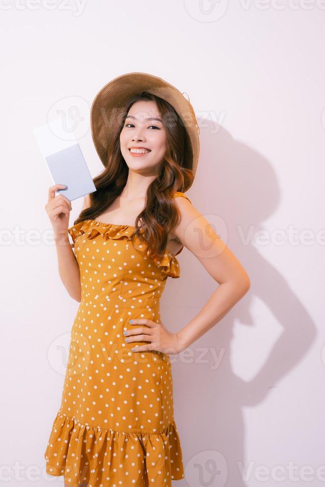 Woman traveler holding passport with ticket. photo