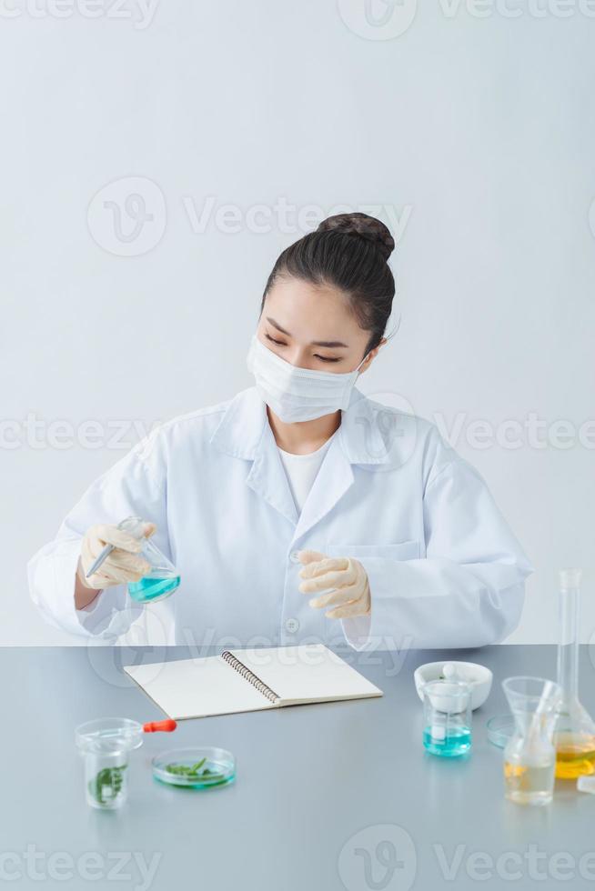 woman makes handmade cosmetics on table photo