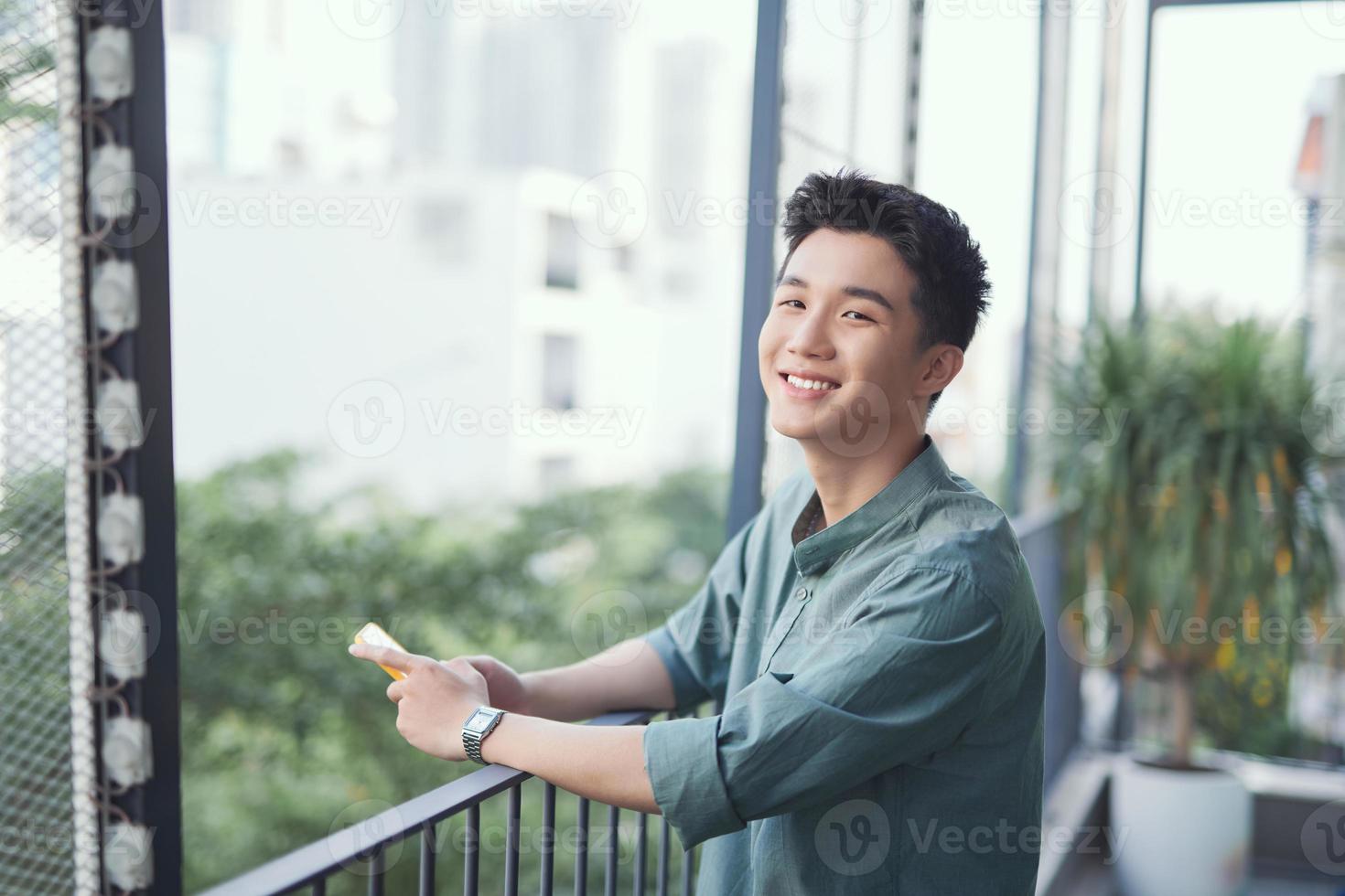 View of a Young attractive business man using smartphone photo