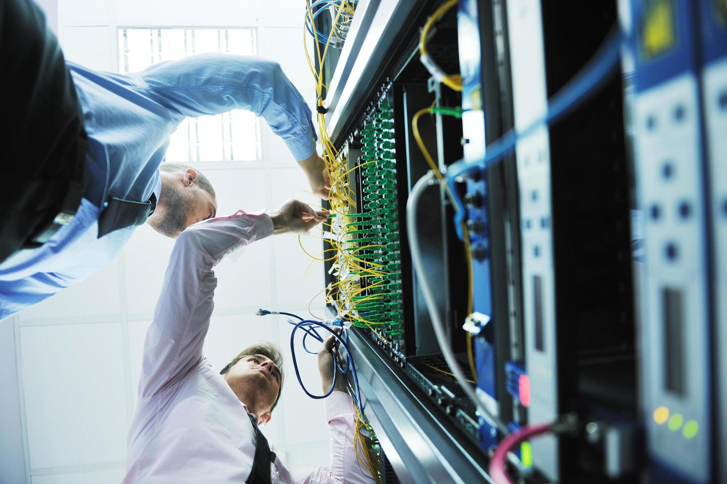 it engineers in network server room photo