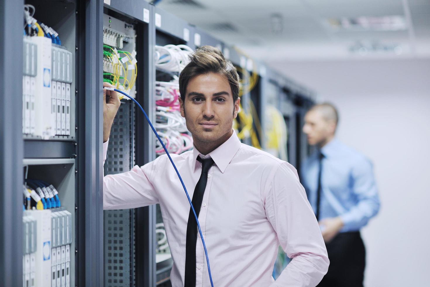 it engineers in network server room photo