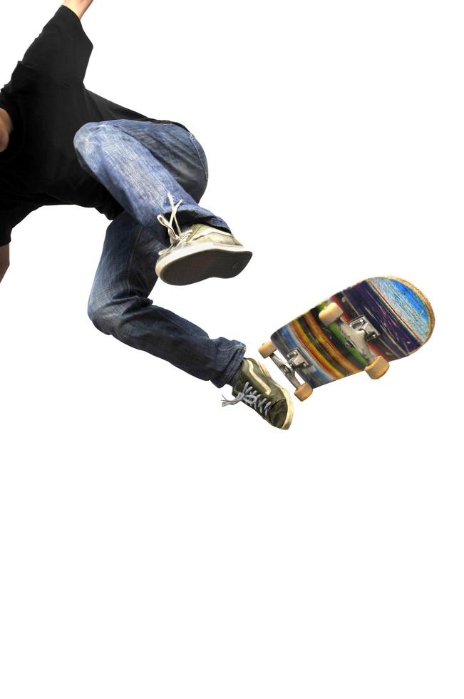 Boy practicing skate in a skate park - isolated photo