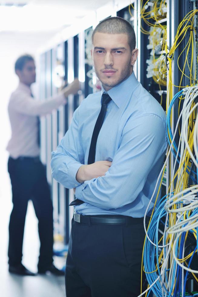 it engineers in network server room photo