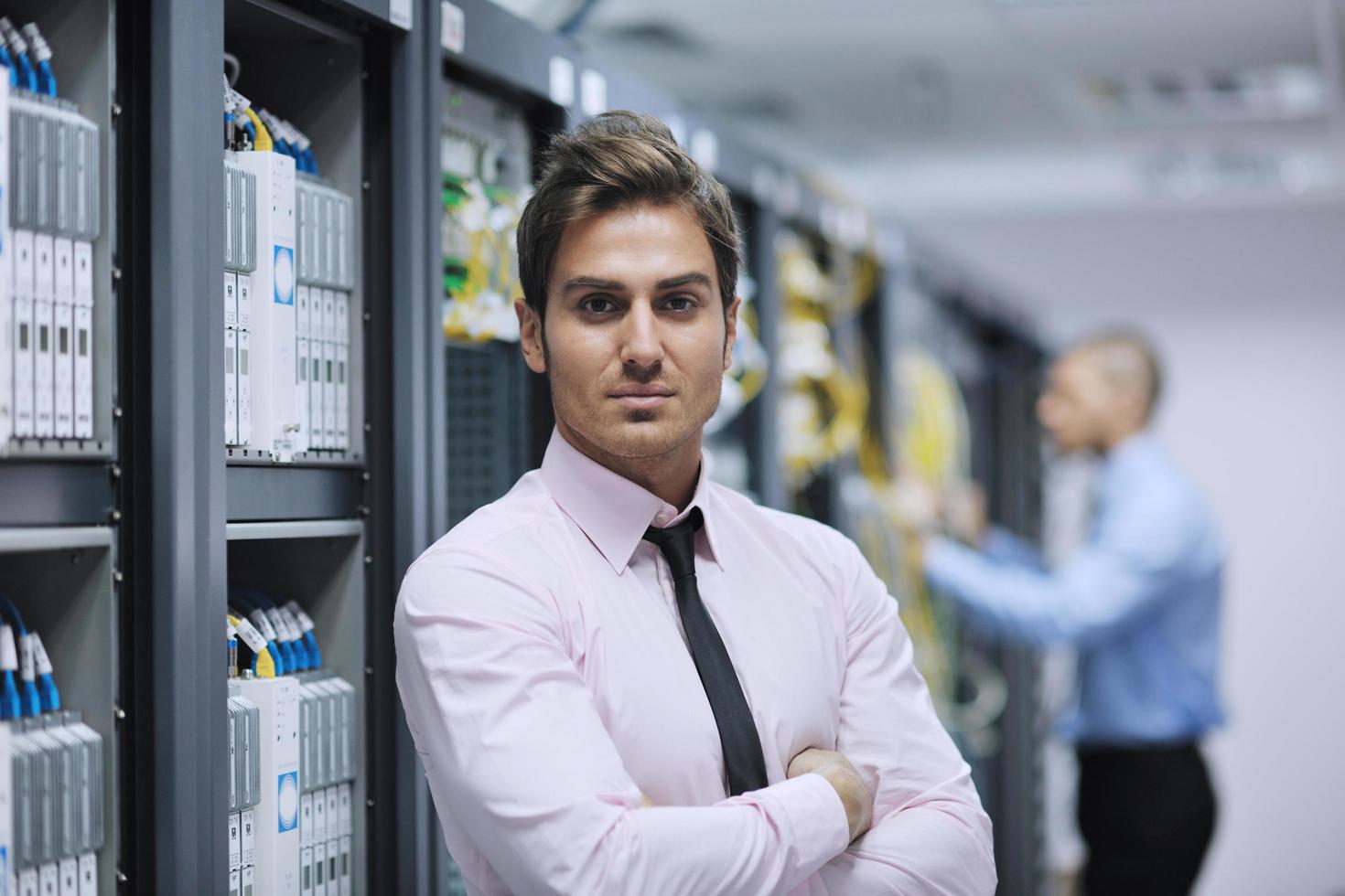 it engineers in network server room photo