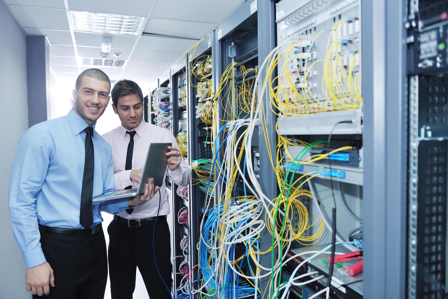 it engineers in network server room photo