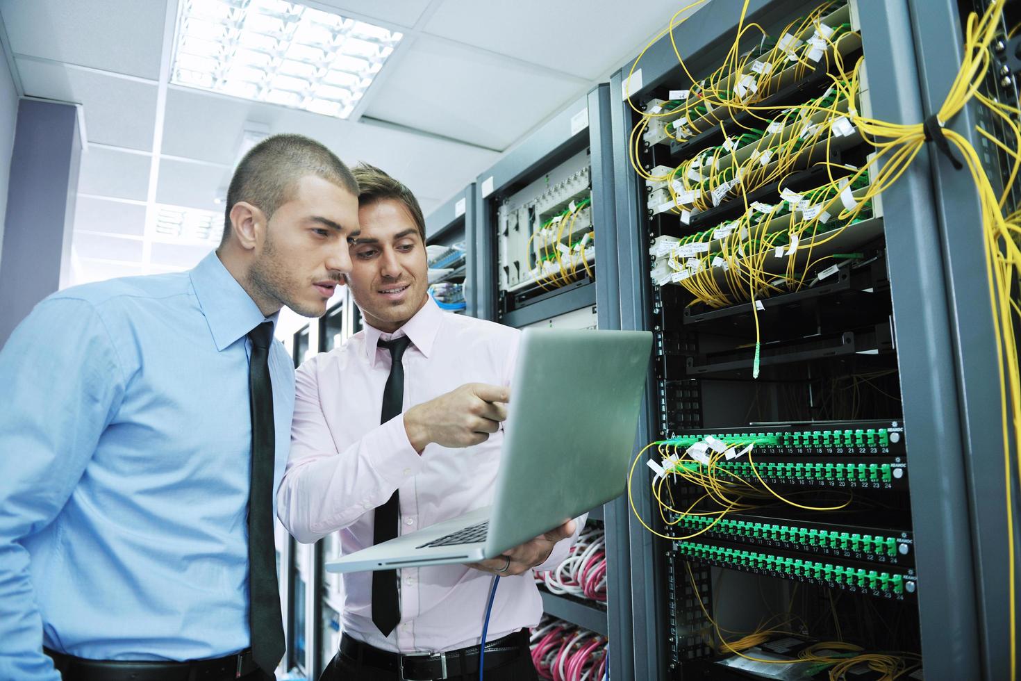 it engineers in network server room photo