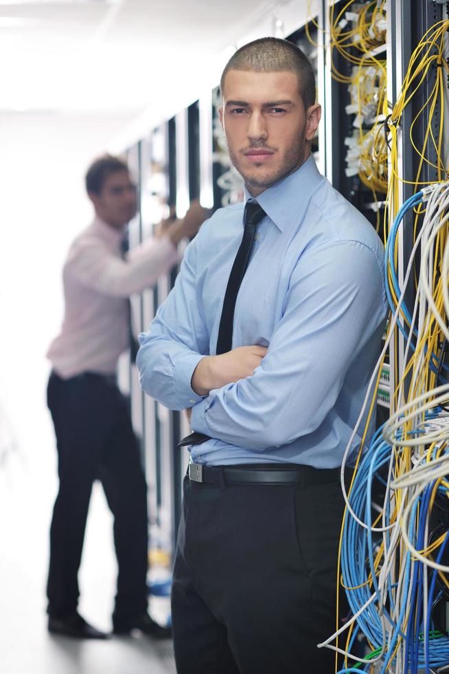it engineers in network server room photo