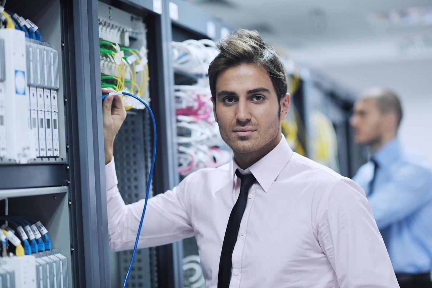 it engineers in network server room photo