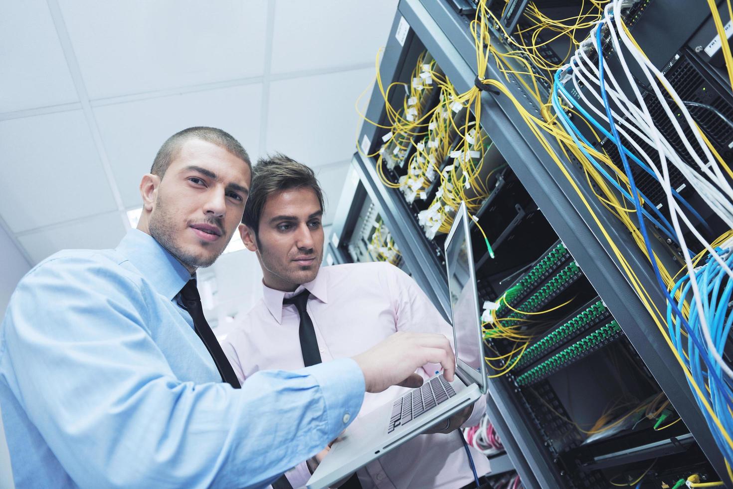 it engineers in network server room photo
