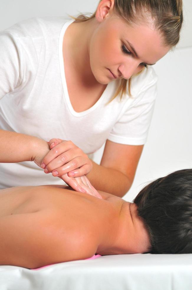 back massage at the spa and wellness center photo