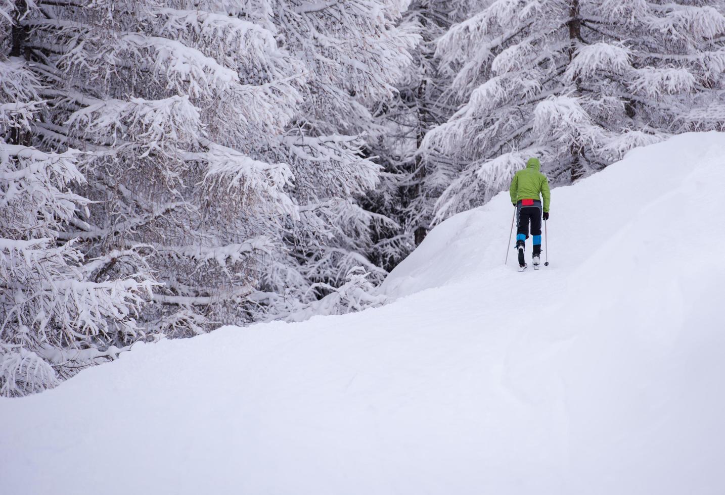 man enjoying cross country skiing photo