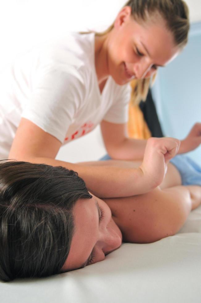 Woman receiving a massage photo