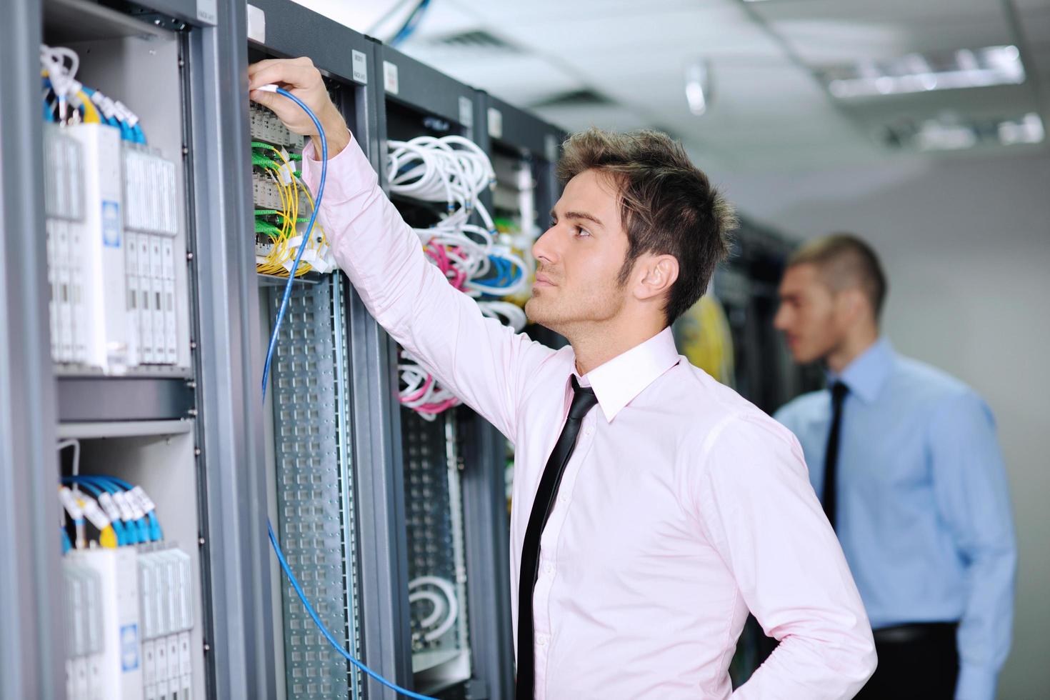 it engineers in network server room photo