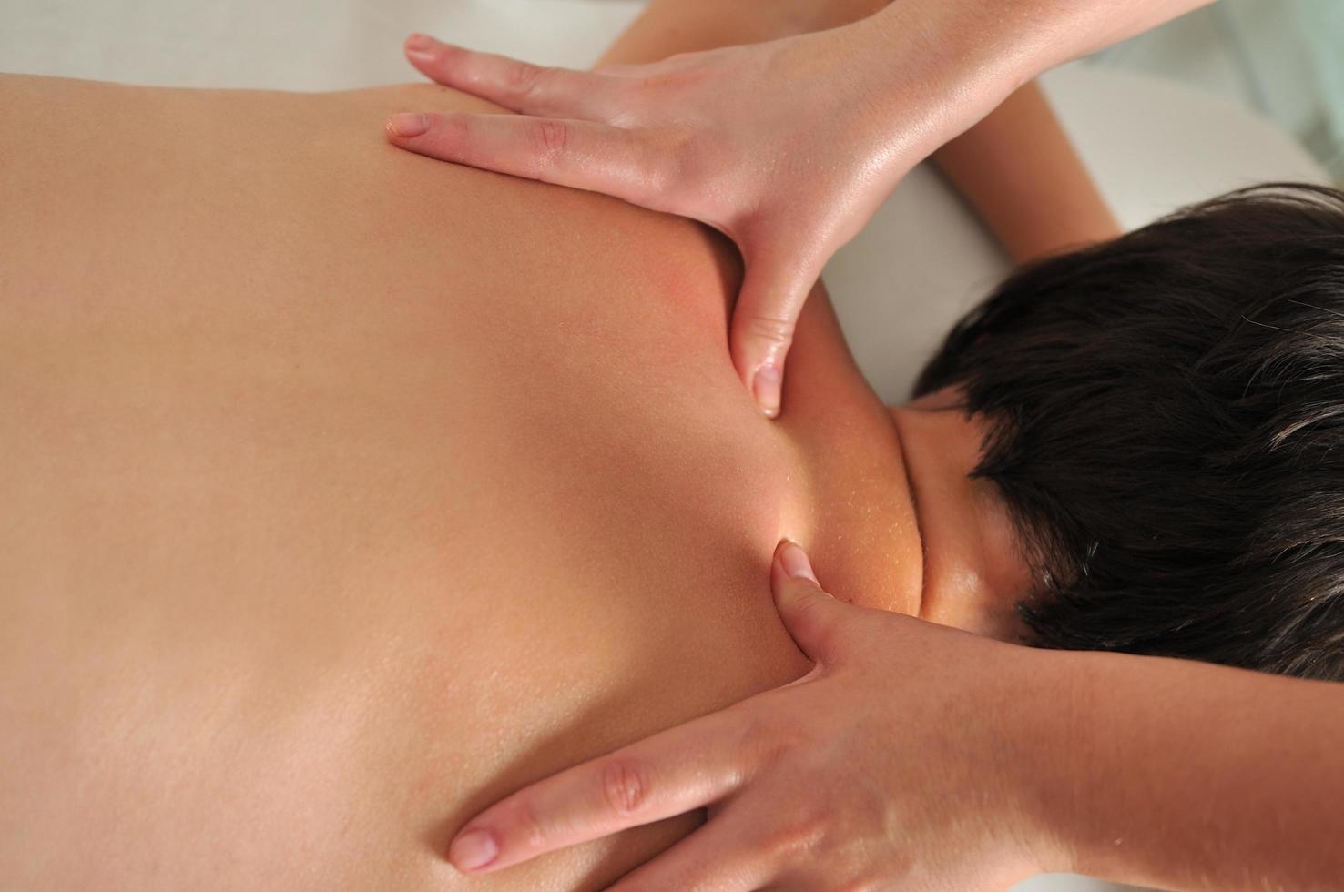 back massage at the spa and wellness center photo