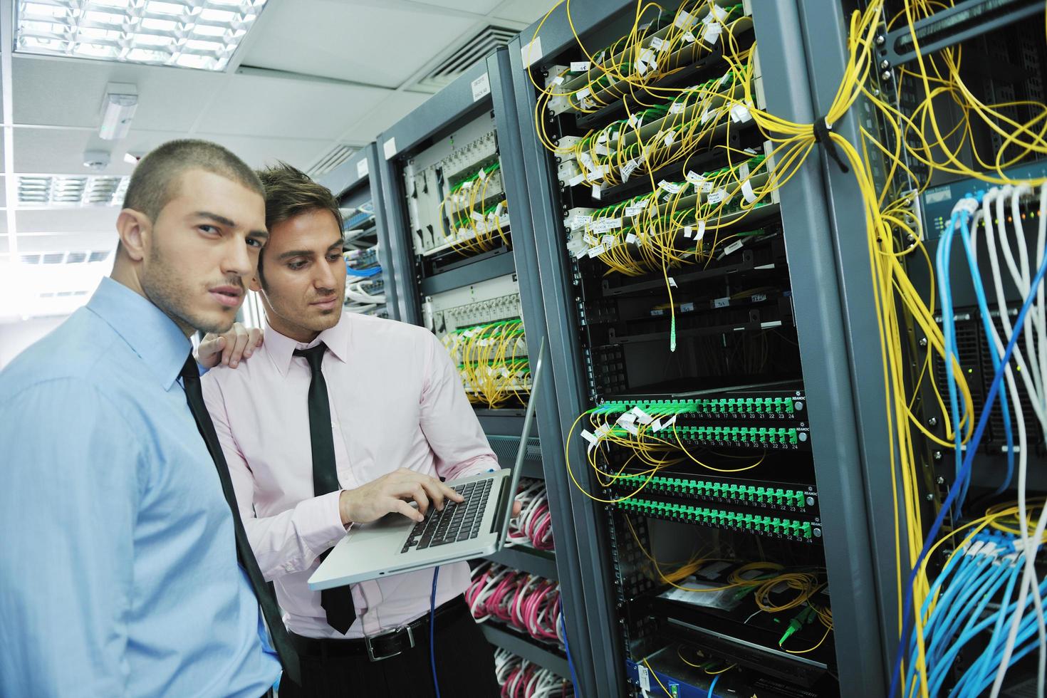it engineers in network server room photo