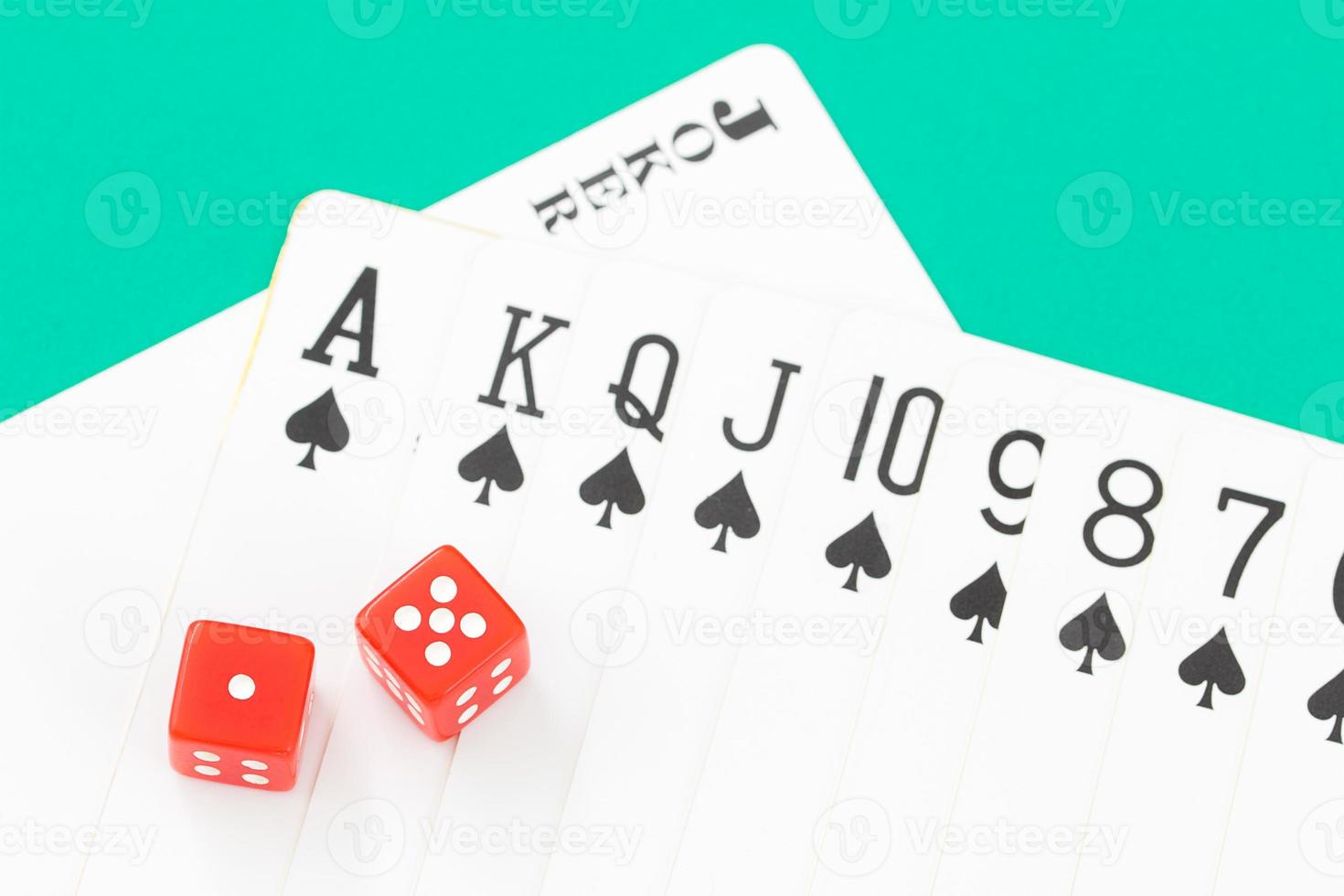 Dices and cards on green casino table photo