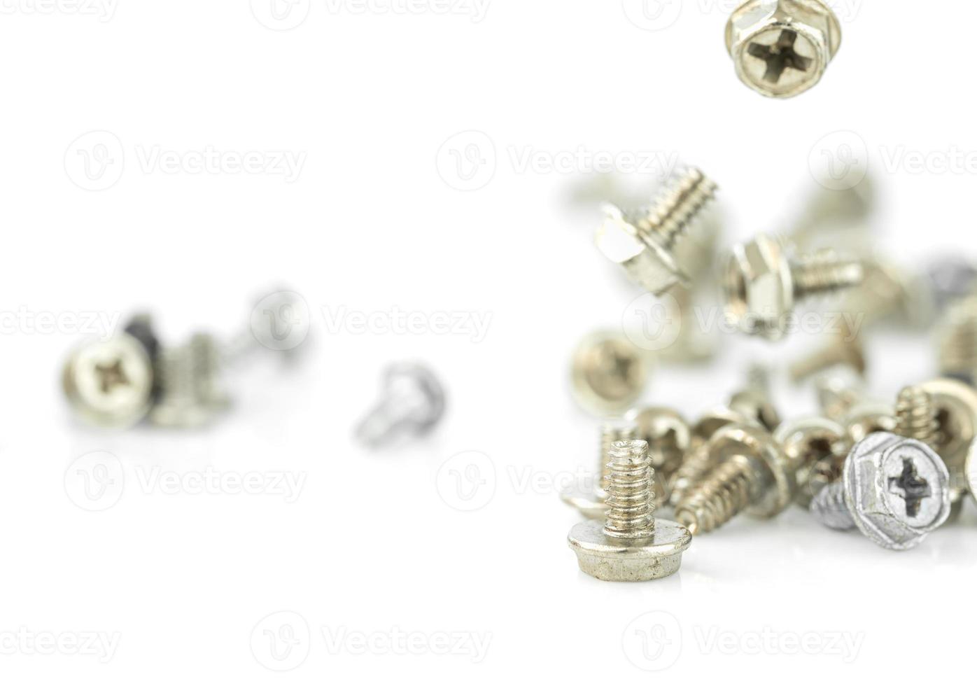 Old screws on the white background photo