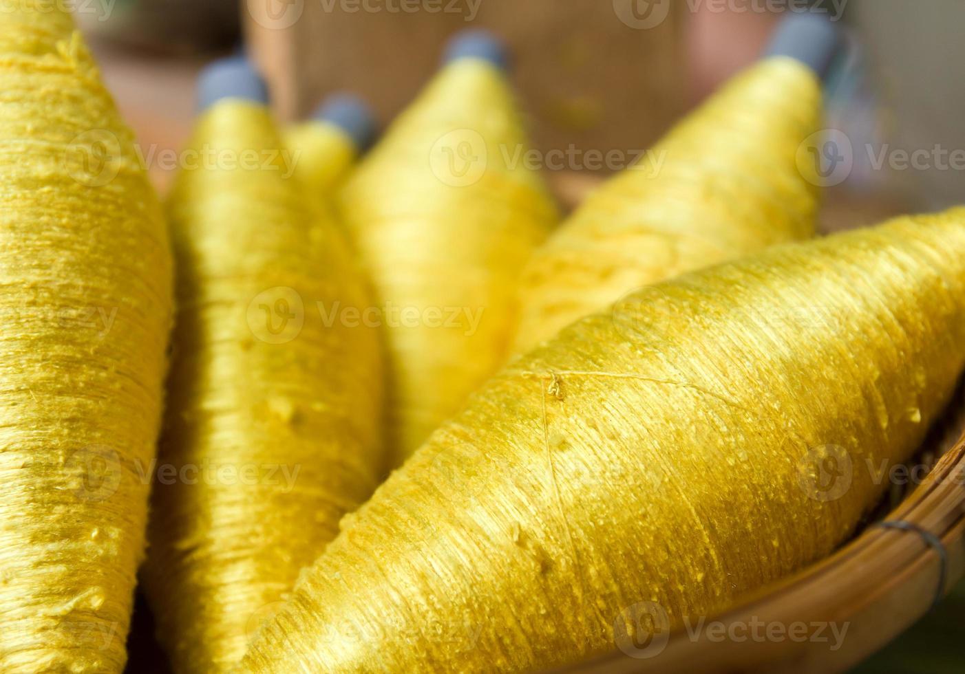 Sewing threads golden color photo