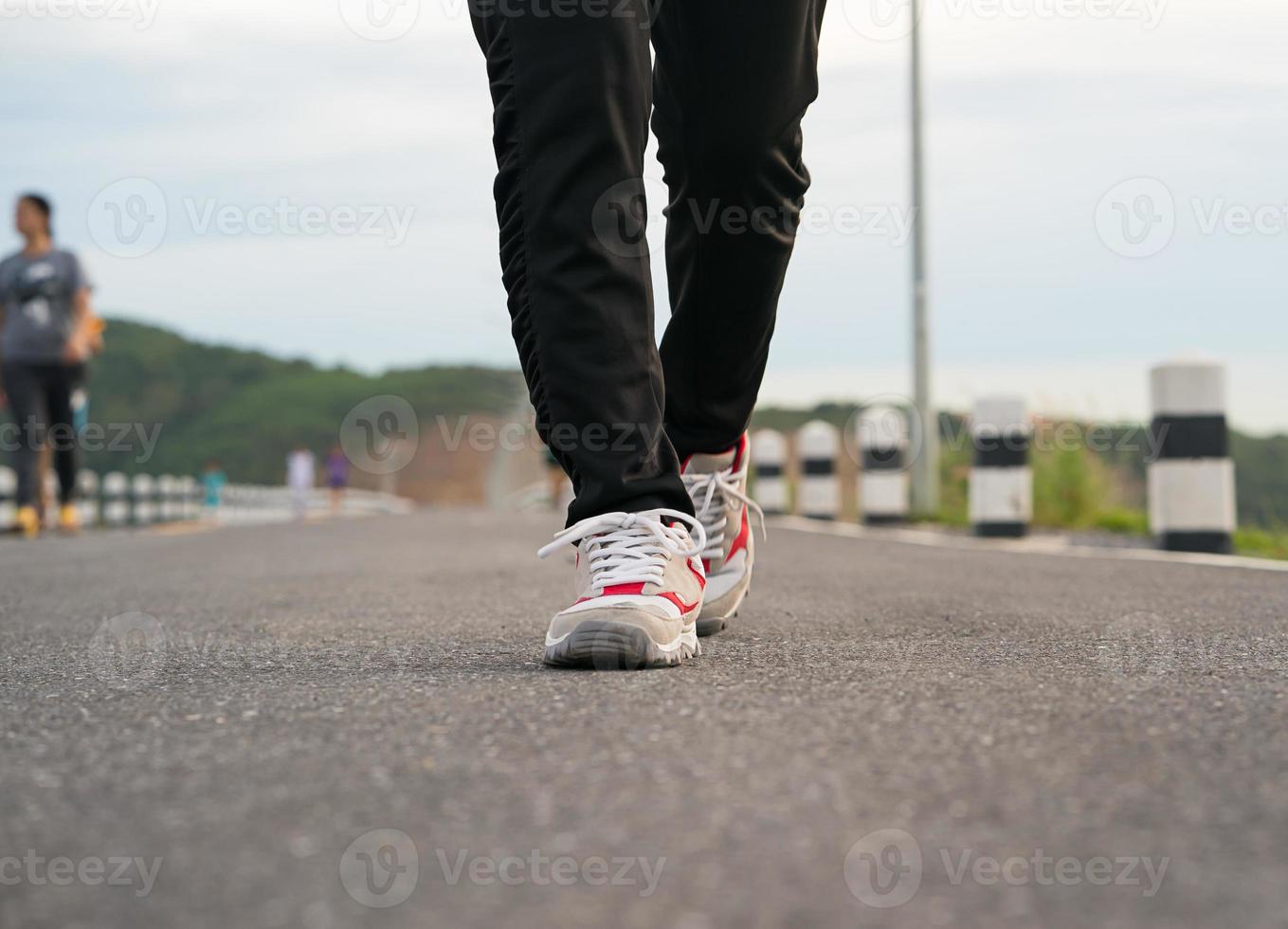 Close up of girl shoes walking photo