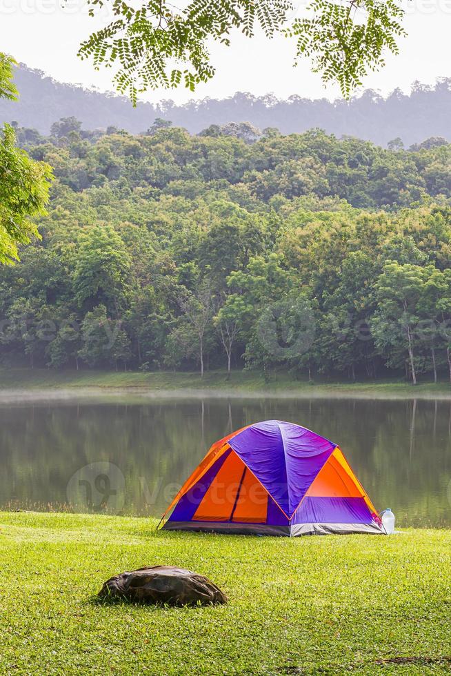 Dome tent camping at lake side photo