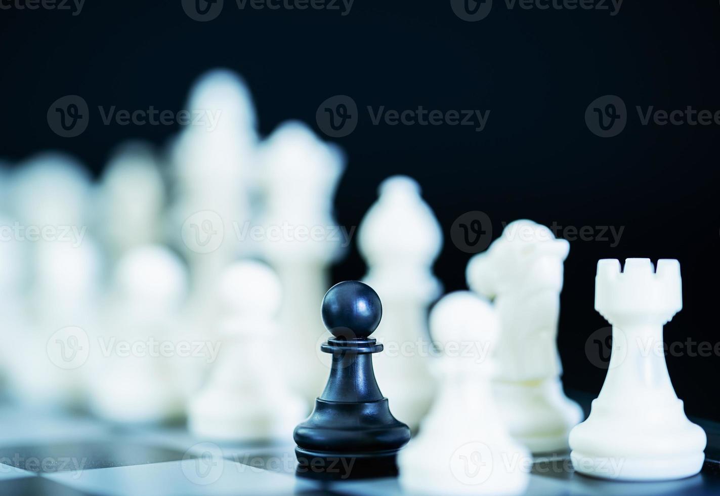 Close up chess pieces on chessboard photo