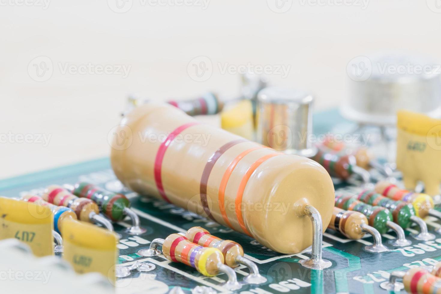 Condensers and Resistor assembly on the circuit board photo