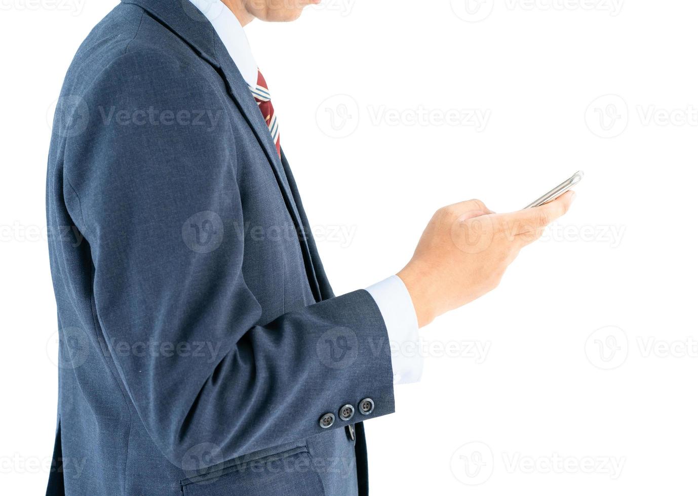 Businessman in suit holding smartphone photo
