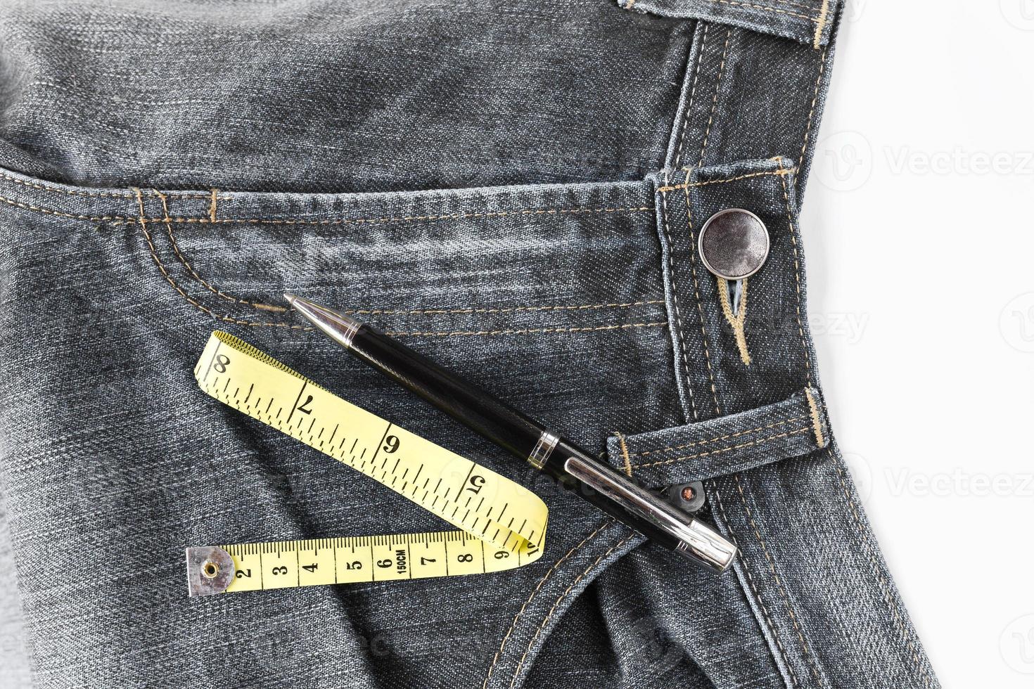 Jeans and measuring tape photo