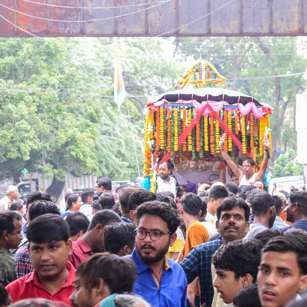 New Delhi, India July 01 2022 - A huge gathering of devotees from different parts of Delhi on the occasion of ratha yatra or rathyatra. Rath for Lord Jagannath pulled by people, Jagannath Rath Yatra photo