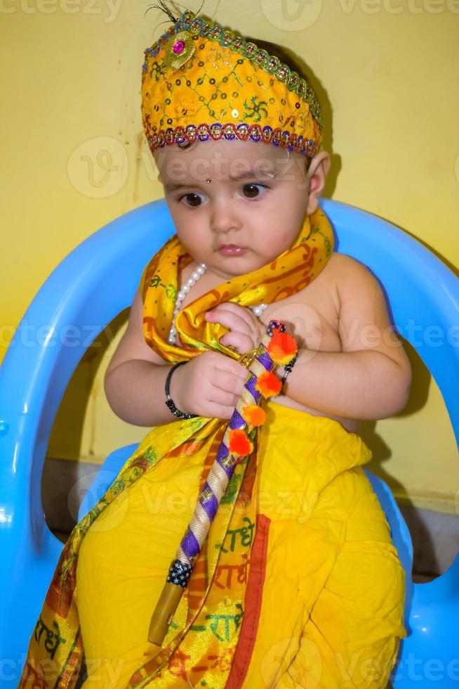 Cute Indian Kid dressed up as little Lord Krishna on the occasion of Radha Krishna Janmastami Festival in Delhi India photo