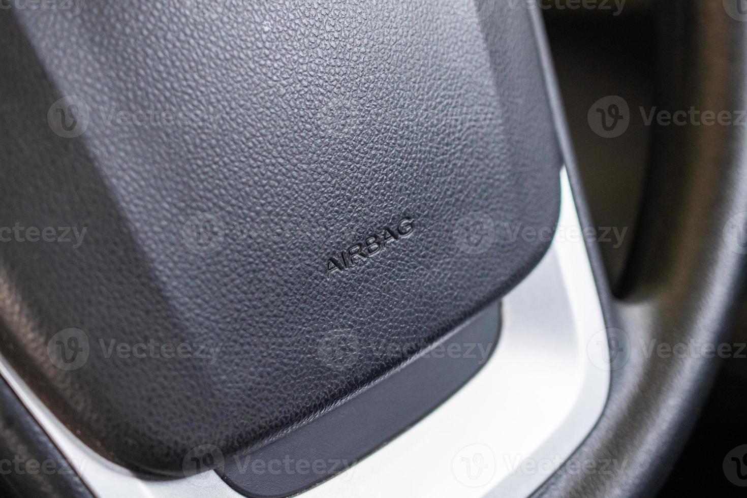 Safety airbag sign on car steering wheel photo