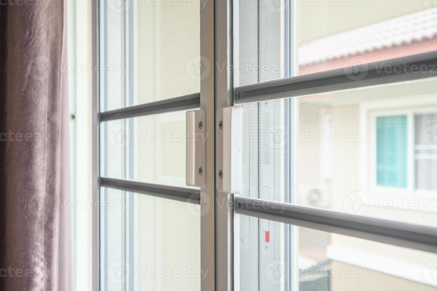 mosquito net wire screen on house window protection against insect photo