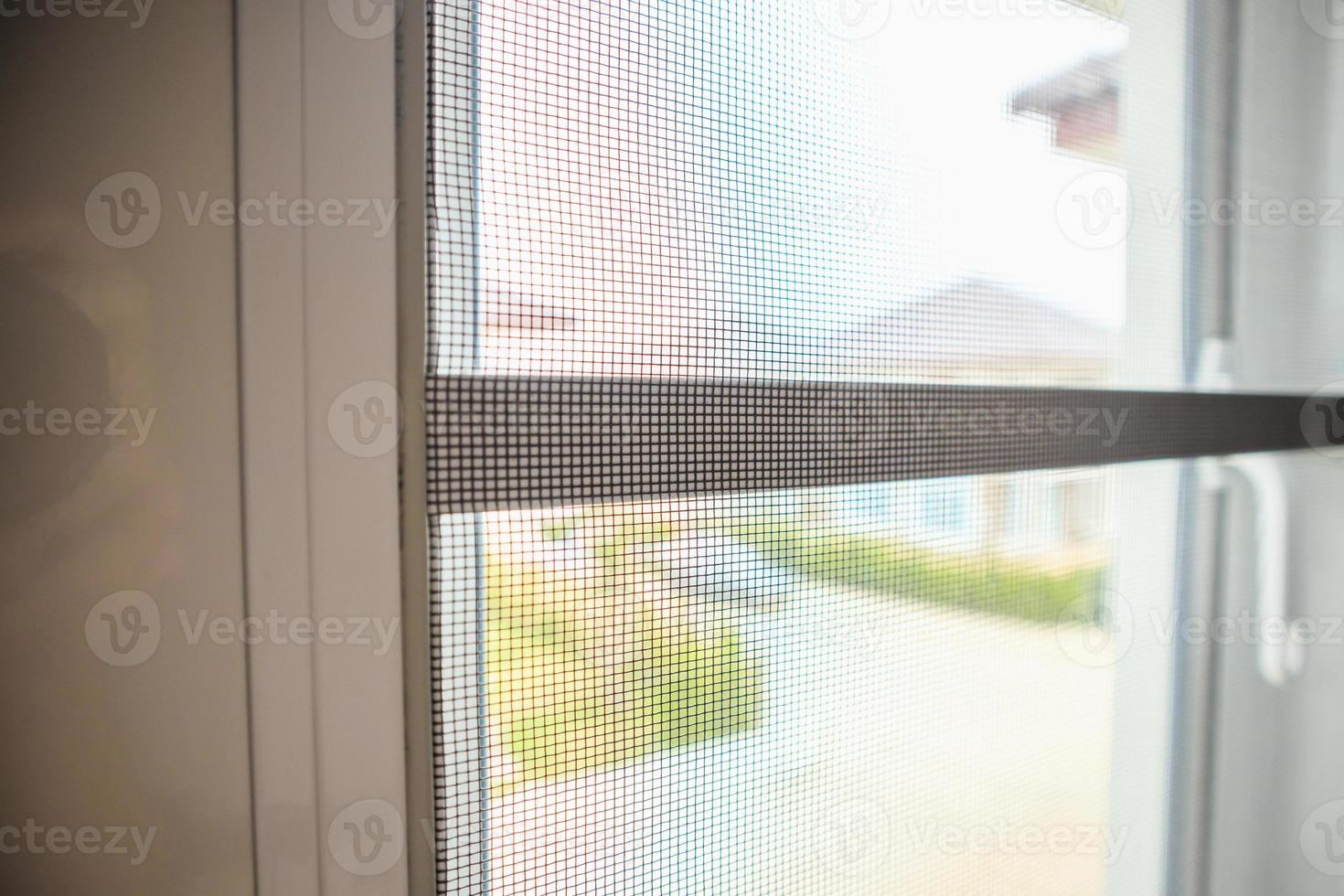 mosquito net wire screen on house window protection against insect photo