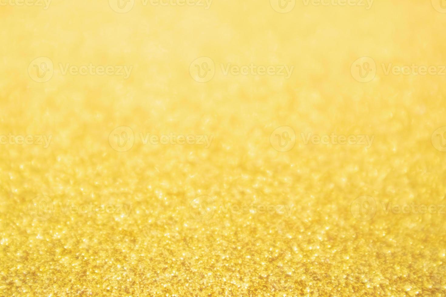 Abstract Gold glitter festive Christmas texture background blur with bokeh light photo