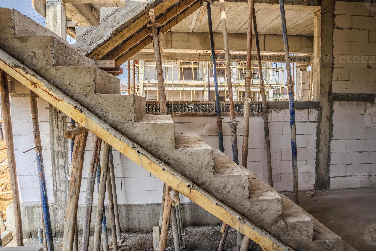 New house construction with concrete staircase at building site photo