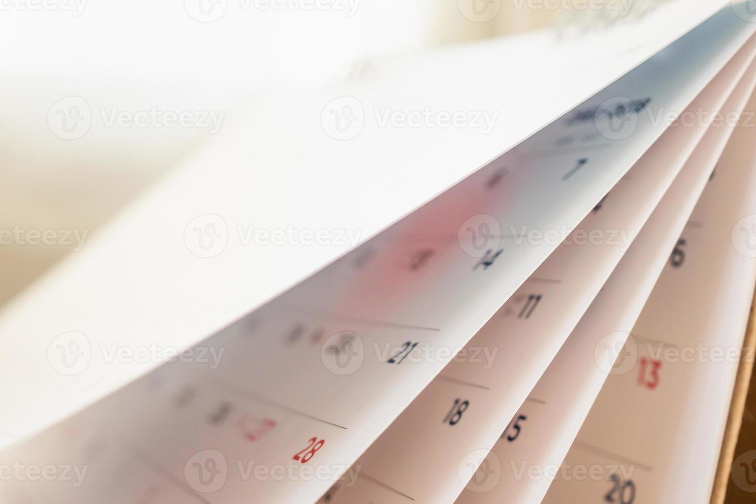 Abstract blur calendar page flipping sheet close up background photo