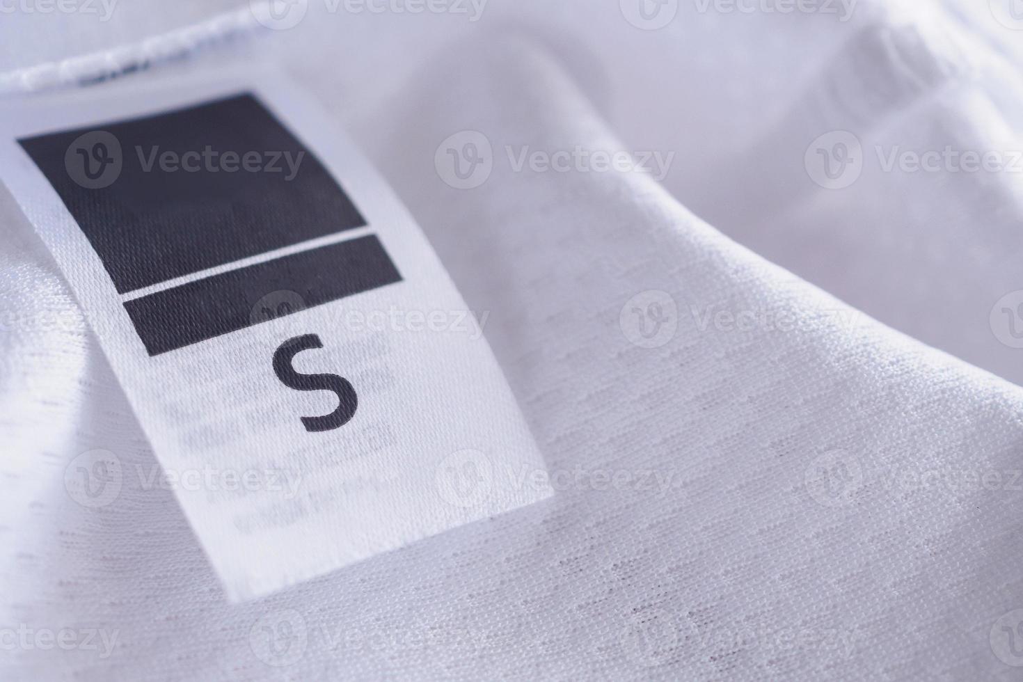 clothes label on sport textile football shirt background photo
