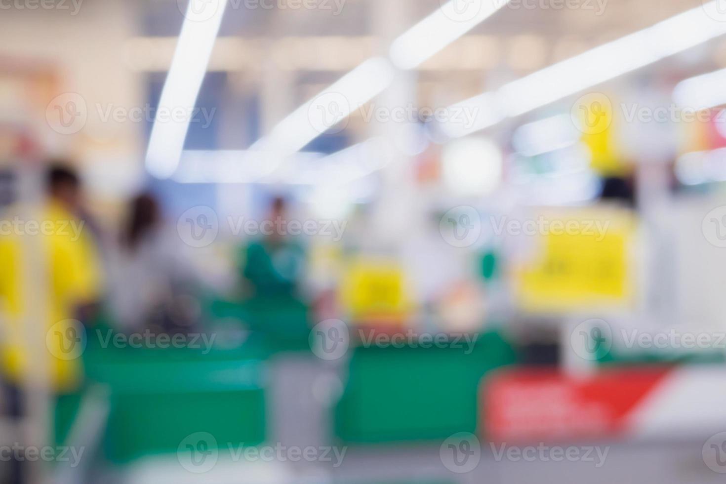 Blur cashier checkout counter in the supermarket photo